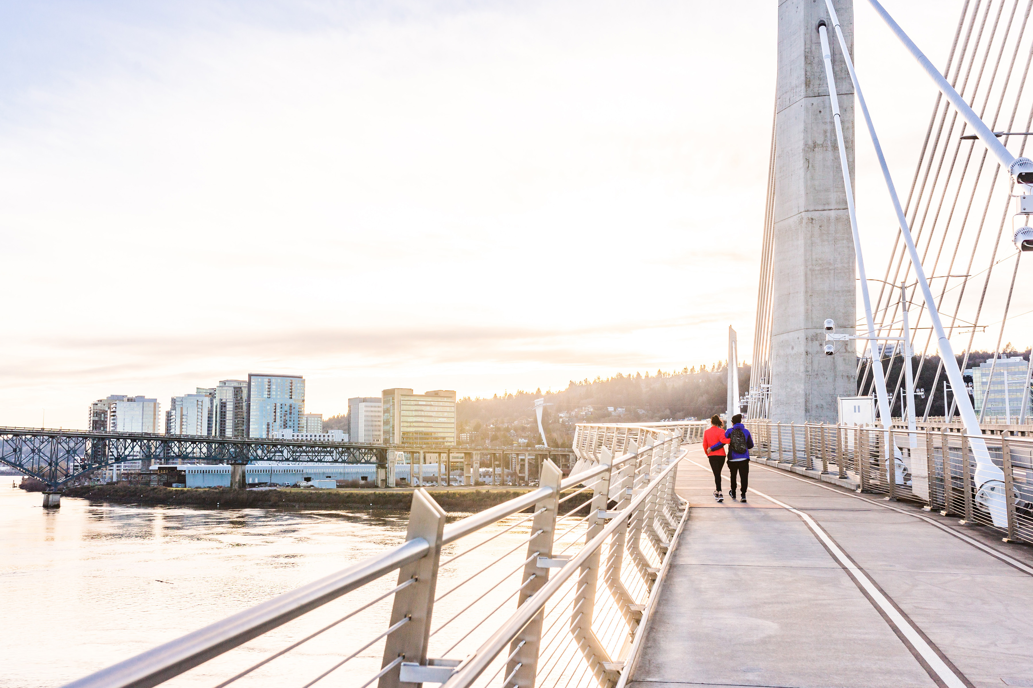 couple walking on a bridge